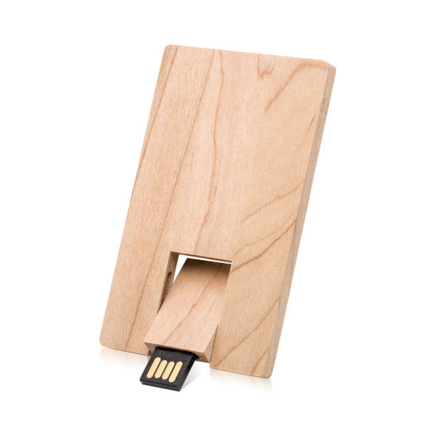 Wooden flash drive isolated on white background. USB stick made from wood material in card concept style. ( Clipping path ) Wooden flash drive isolated on white background. USB stick made from wood material in card concept style. ( Clipping path ) wooden flash drive stock pictures, royalty-free photos & images