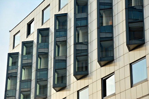 Modern office Corporate business glass building and blue sky