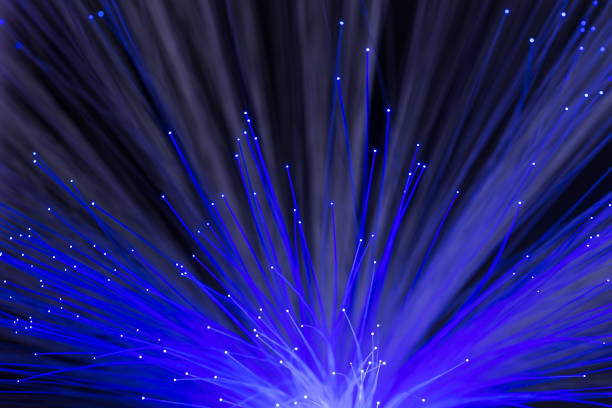 istock Glowing optical fibers. Abstract background. 918109932