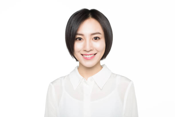 portrait of young woman,white background beautiful woman smiling over white background,China. chinese woman stock pictures, royalty-free photos & images