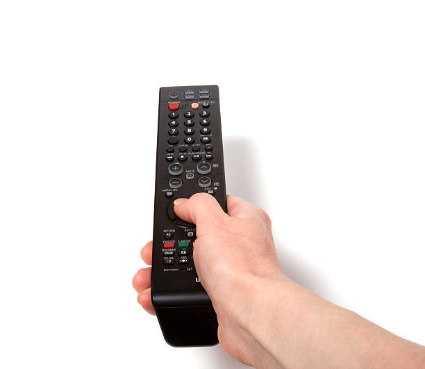istock Hand holding tv remote control isolated on white background 91811203