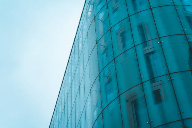 istock curved and modern blue glass facade 918113360