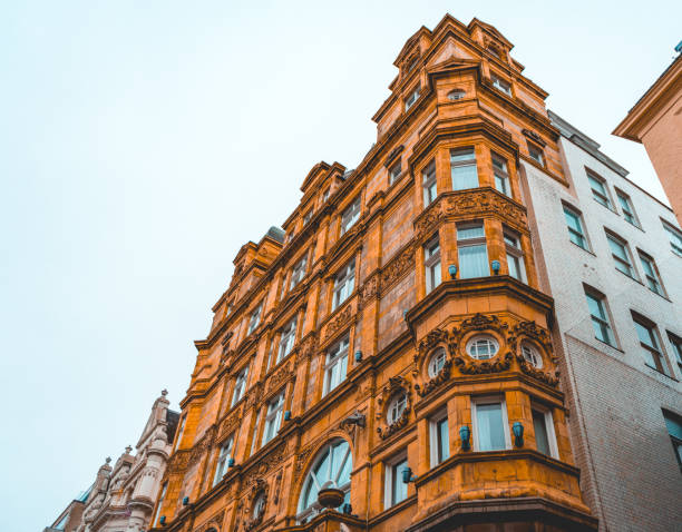 istock orange historical apartment building at london in low angle view 918116784