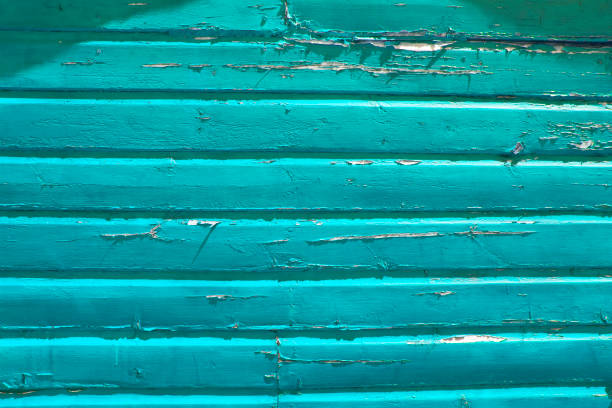 Close up of an old painted wooden shed in turquoise
