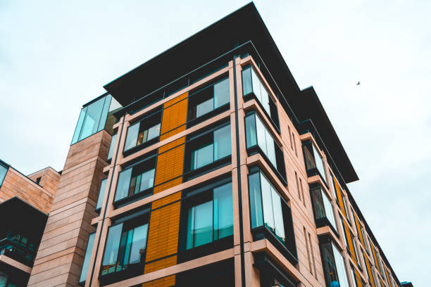 istock low angle view of modern orange apartment building 918120918