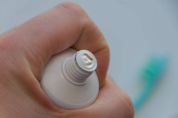 istock in the hands of a closed toothpaste 918123840