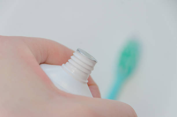 istock in the hands of a closed toothpaste, close-up 918123964
