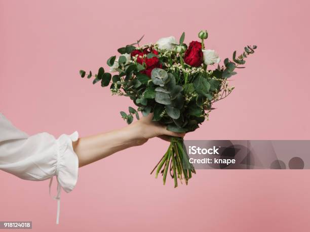 Photo Of Woman Holding Beautiful Bouquet Of Flowers Roses Pink Background Stock Photo - Download Image Now