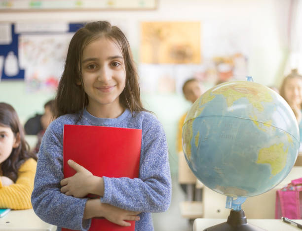 istock one girl student smiling at the classroom 918124132