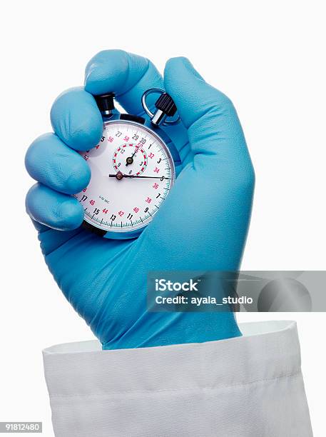 Doctor Holding Chronometer Stock Photo - Download Image Now - Stopwatch, Time, Doctor