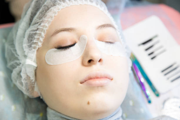 istock A young girl increases eyelashes in a beauty salon. 918128018