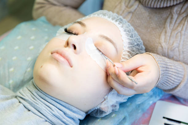 istock A young girl increases eyelashes in a beauty salon. 918128030