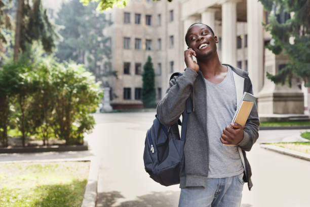 istock Happy african-american student talking on smartphone in campus 918128644