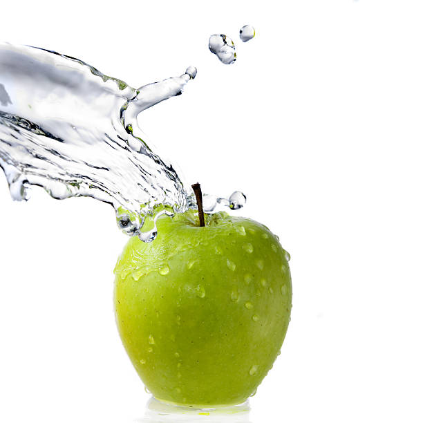 istock fresh water splash and green apple isolated on white 91812868