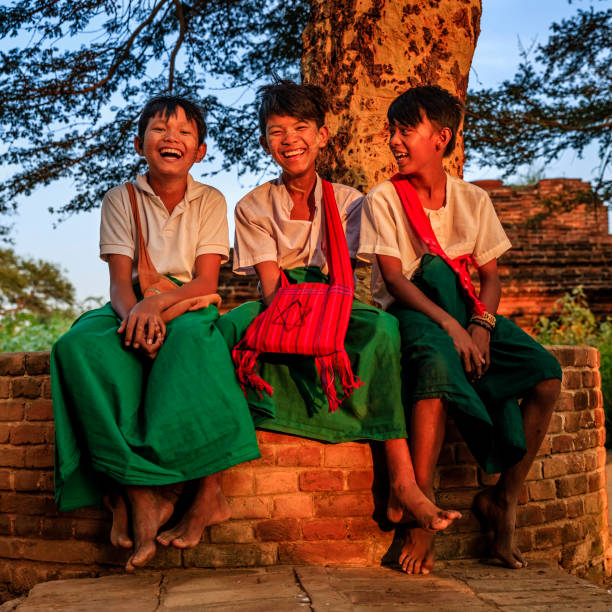 istock Young Burmese schoolboys resting in Bagan, Myanmar 918128730