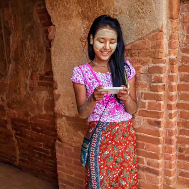 istock Young Burmese girl using a mobile phone in Bagan, Myanmar 918130926