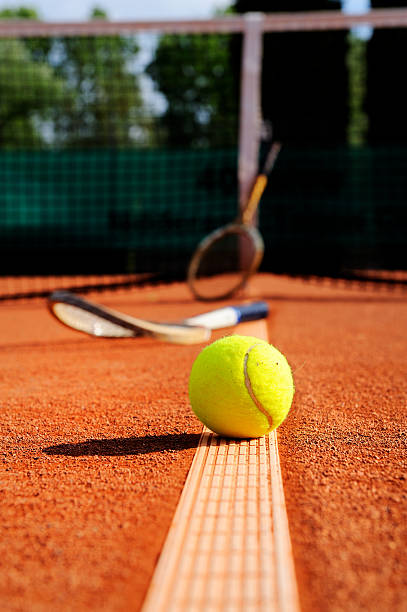 istock tennis ball, racket and net 91813410