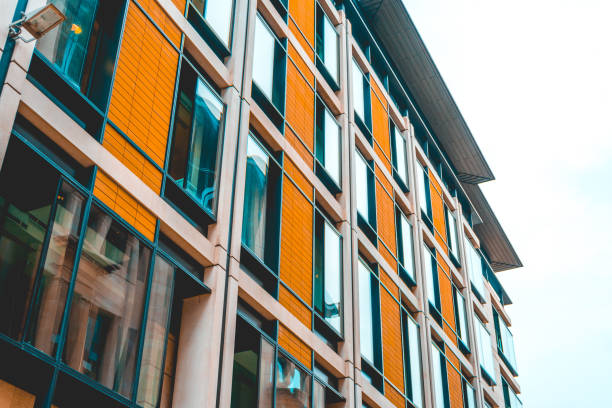 istock modern orange apartment building with big windows 918135332