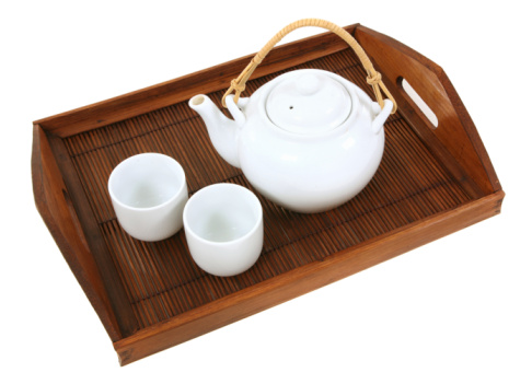 Top view of blue ceramic tea set with cups isolated on white background with clipping path.