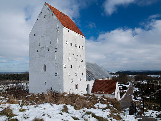 church of our lady with five towers and the church office in a half-timbered house, Kaulundborg, Denmark, April 4, 2023