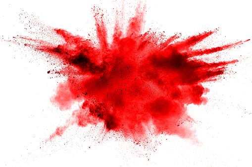 Abstracto rojo polvo salpicado sobre fondo blanco. Explosión de polvo rojo sobre fondo blanco. Congelar movimiento de salpicaduras de partículas rojas. photo