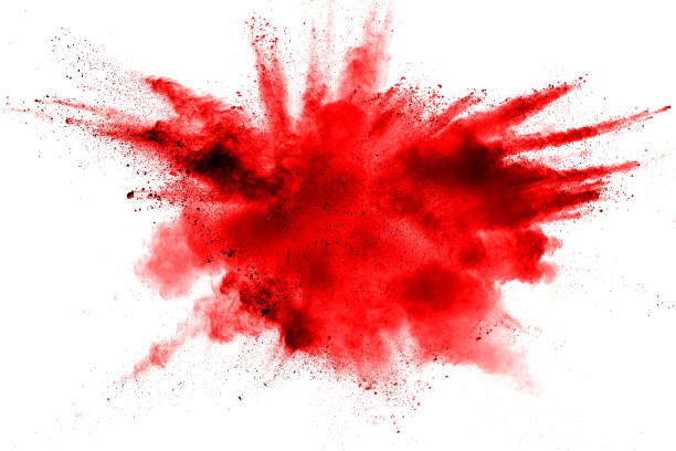 abstracto rojo polvo salpicado sobre fondo blanco. explosión de polvo rojo sobre fondo blanco. congelar movimiento de salpicaduras de partículas rojas. - explosive fotografías e imágenes de stock