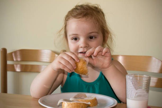 Little girl eat breakfast