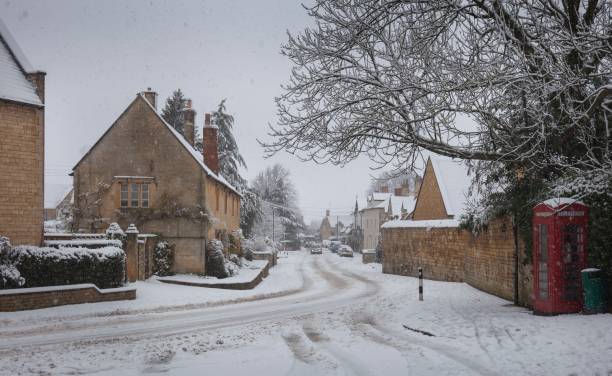 istock Cotswold village in snow, Gloucestershire, England 918142160