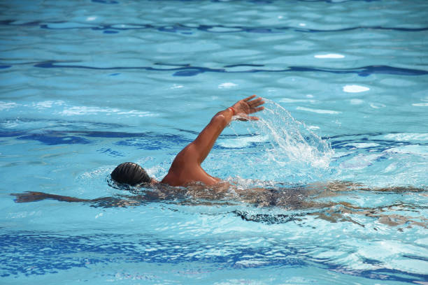 istock Man swimming in a swimming pool 918143300