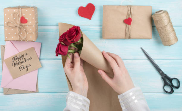 istock Valentine day theme. Top view of workplace for preparing handmade decorations. 918143424