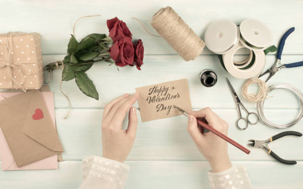 istock Valentine day theme. Top view of workplace for preparing handmade decorations. 918143462