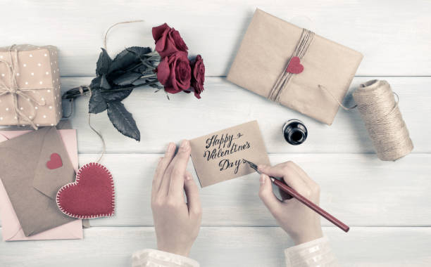 istock Valentine day theme. Top view of workplace for preparing handmade decorations. 918143474