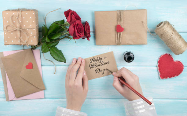 istock Valentine day theme. Top view of workplace for preparing handmade decorations. 918143480