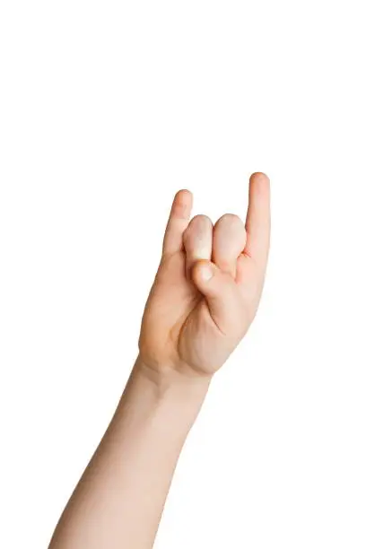 Kid hand making rock'n'roll gesture, isolated on white background