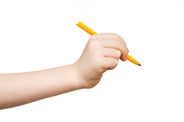 istock Kid hand holding felt-tip pen isolated on white 918145158