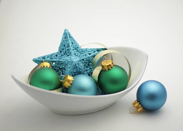Fir-tree and Christmas jewelry on a wooden background. Top view, copy space. Food background. Toning