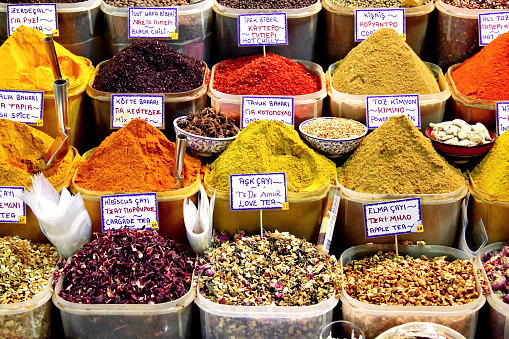 Indian spices in wooden display.