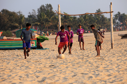 Kasargod, India -January 01,2018 : Unidentified children play football in the sandy beach of Bekal in Kasargod, Kerala, India