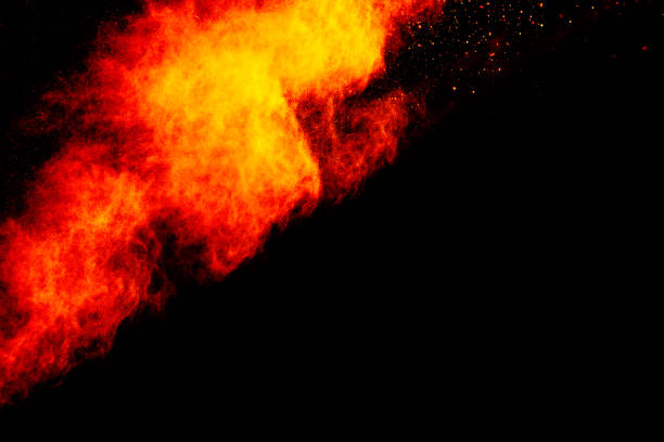 istock Red orange color powder explosion cloud isolated on black background. 918149878