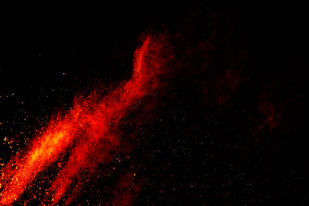 istock Red orange color powder explosion cloud isolated on black background. 918149926