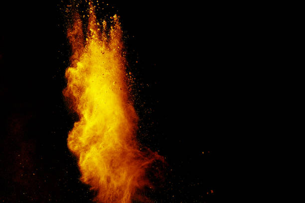 istock Red orange color powder explosion cloud isolated on black background. 918149978