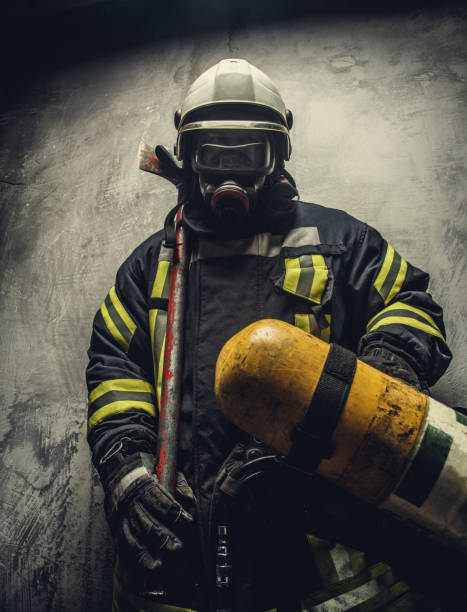 istock Portrait of firefighter in safety uniform. 918153440