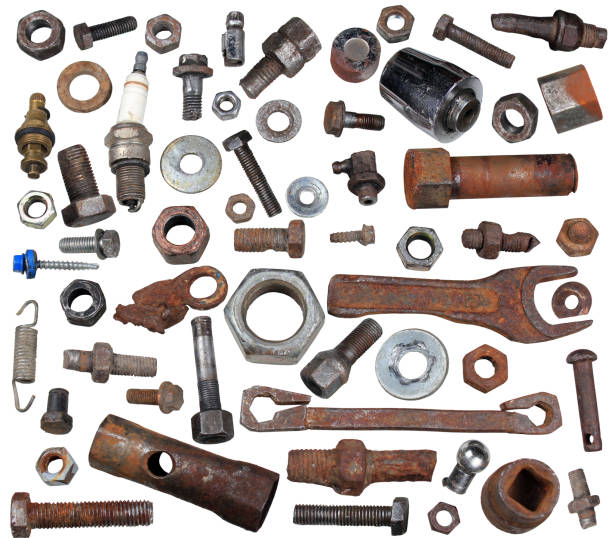 Old rusty bolts, nuts and mechanical parts isolated on white background