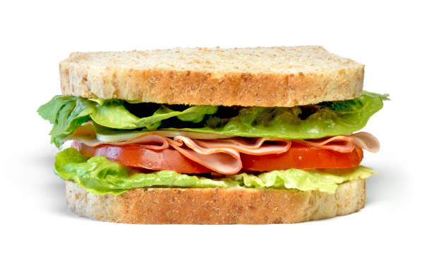 Delicious ham and cheese sandwich Delicious ham and cheese sandwich, isolated on white background. Gourmet toast or sandwich with lettuce, tomato, chess and turkey. Whole grain sandwich, healthy eating. sandwich healthy lifestyle healthy eating bread stock pictures, royalty-free photos & images