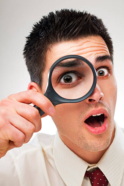 istock Business man with loupe 91815927