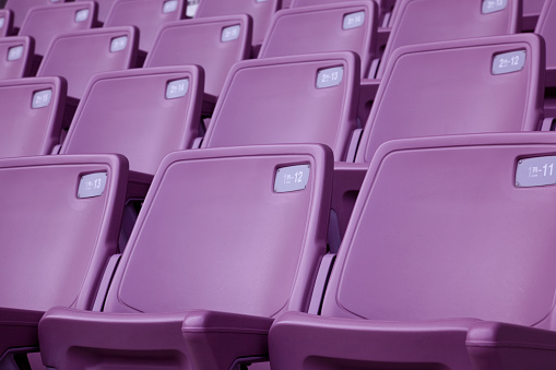 purple tribune seats in a stadium.