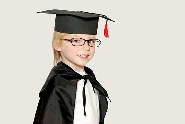 istock schoolboy in graduation cap isolated 91816533