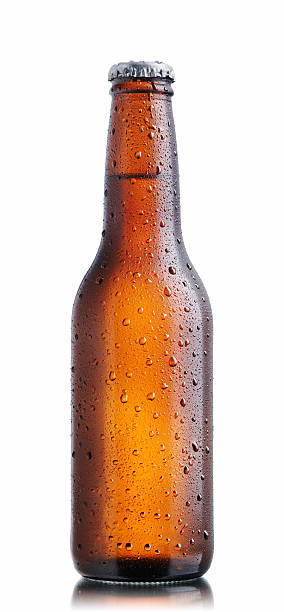Brown beer bottle with drops  beer bottle stock pictures, royalty-free photos & images