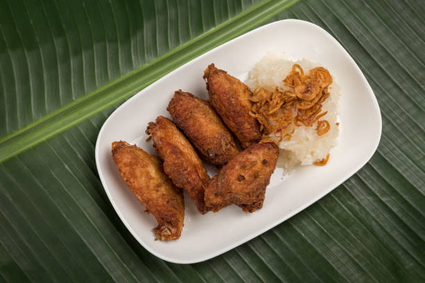 istock Sticky Rice and Fried chicken in plate on banana leaf 918170144