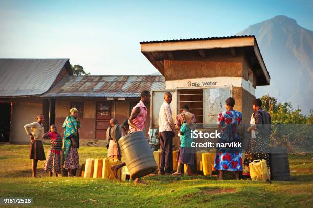 Locals Waiting To Get Drinking Water In Ugandan Village Stock Photo - Download Image Now